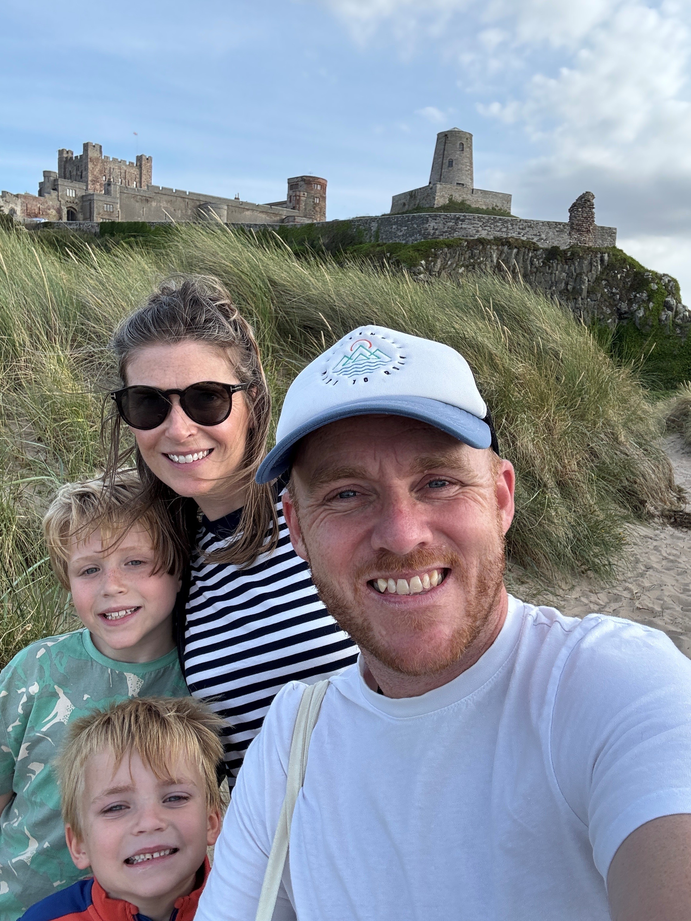 Tom with family at Bamburgh Castle